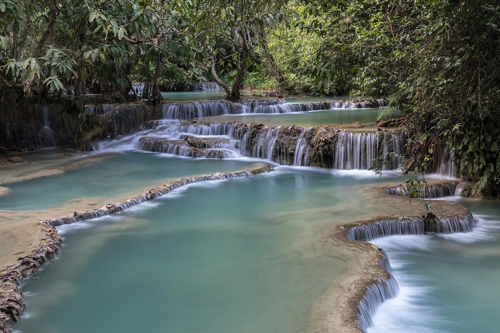 Turquoise limestone pools below the Kuang Si falls Turquoise limestone pools below the Kuang Si falls