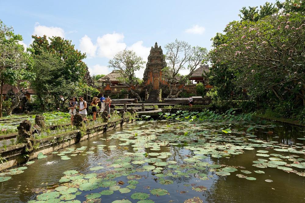 A stone temple gateway with offerings laid at its foot A stone temple gateway with offerings laid at its foot